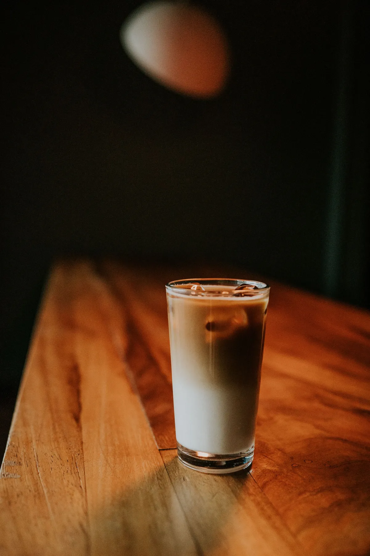 Iced milk coffee on a wooden table