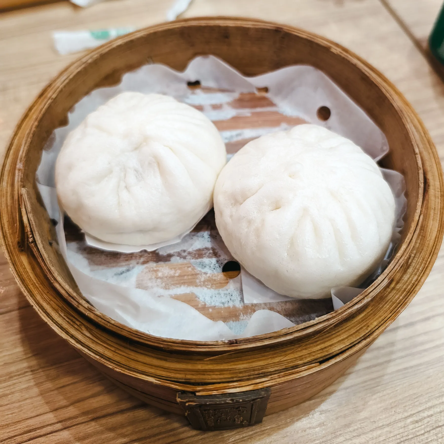 Steamed buns in a bamboo steamer