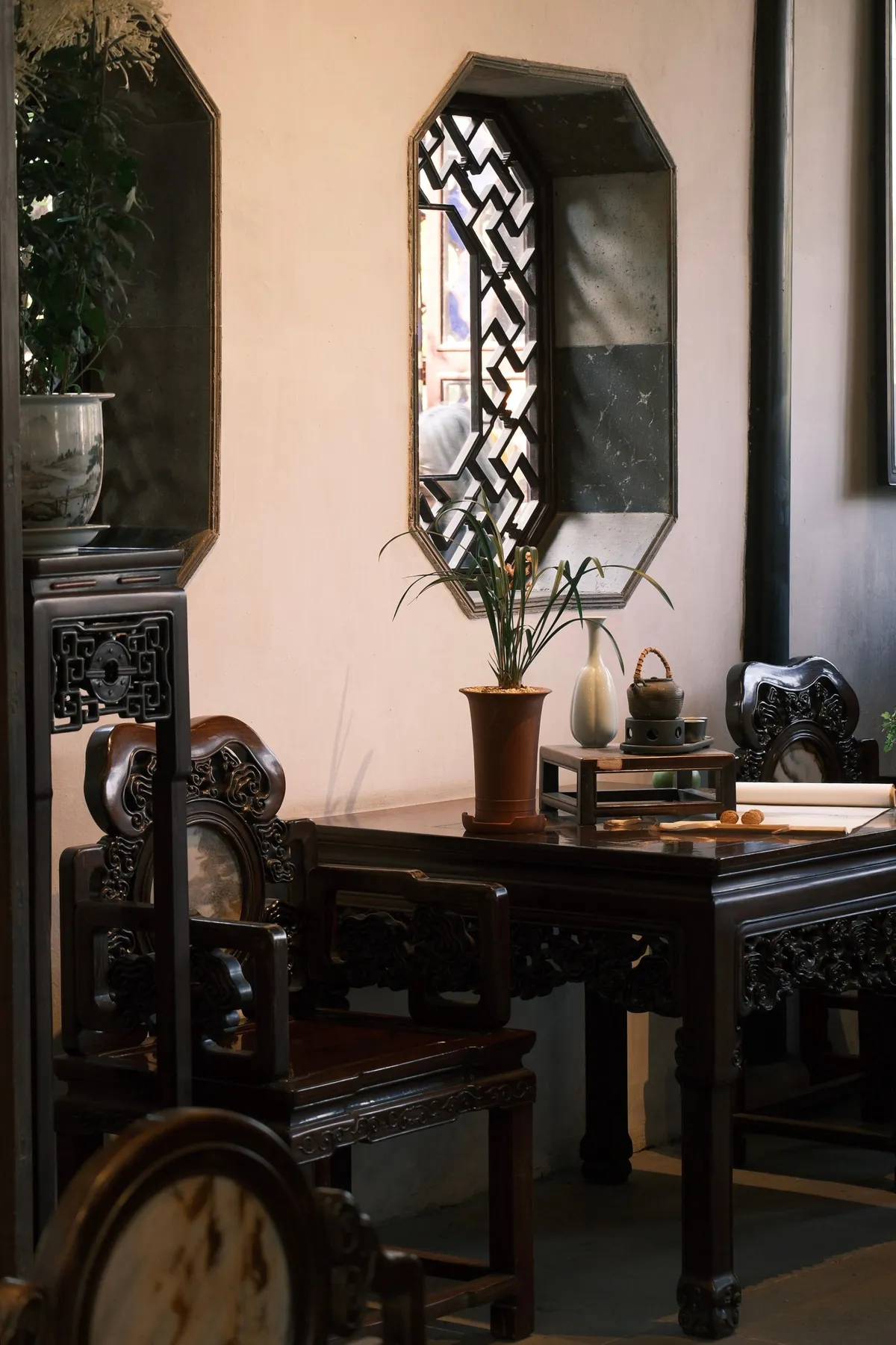 Wooden armchair beside a round window